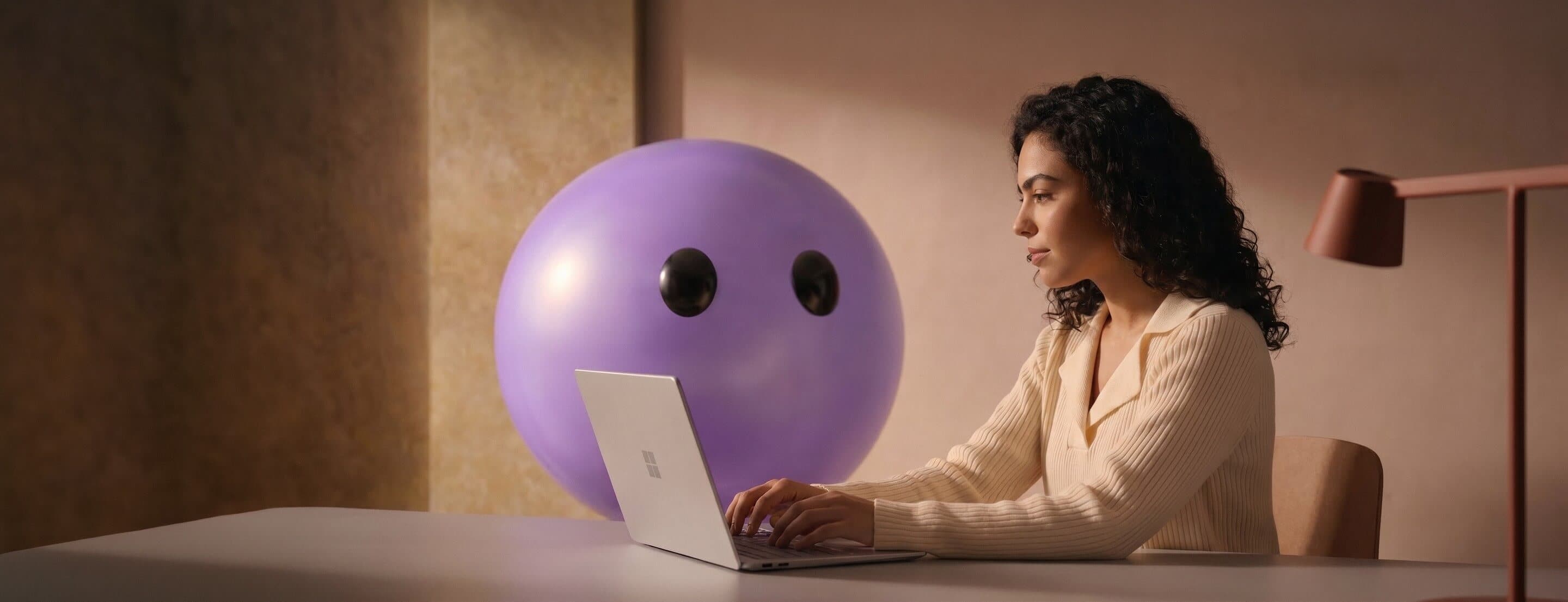 A support agent working at a laptop beside the Ayro mascot